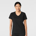 Black WonderWink 6251 Top worn by a person on a white background