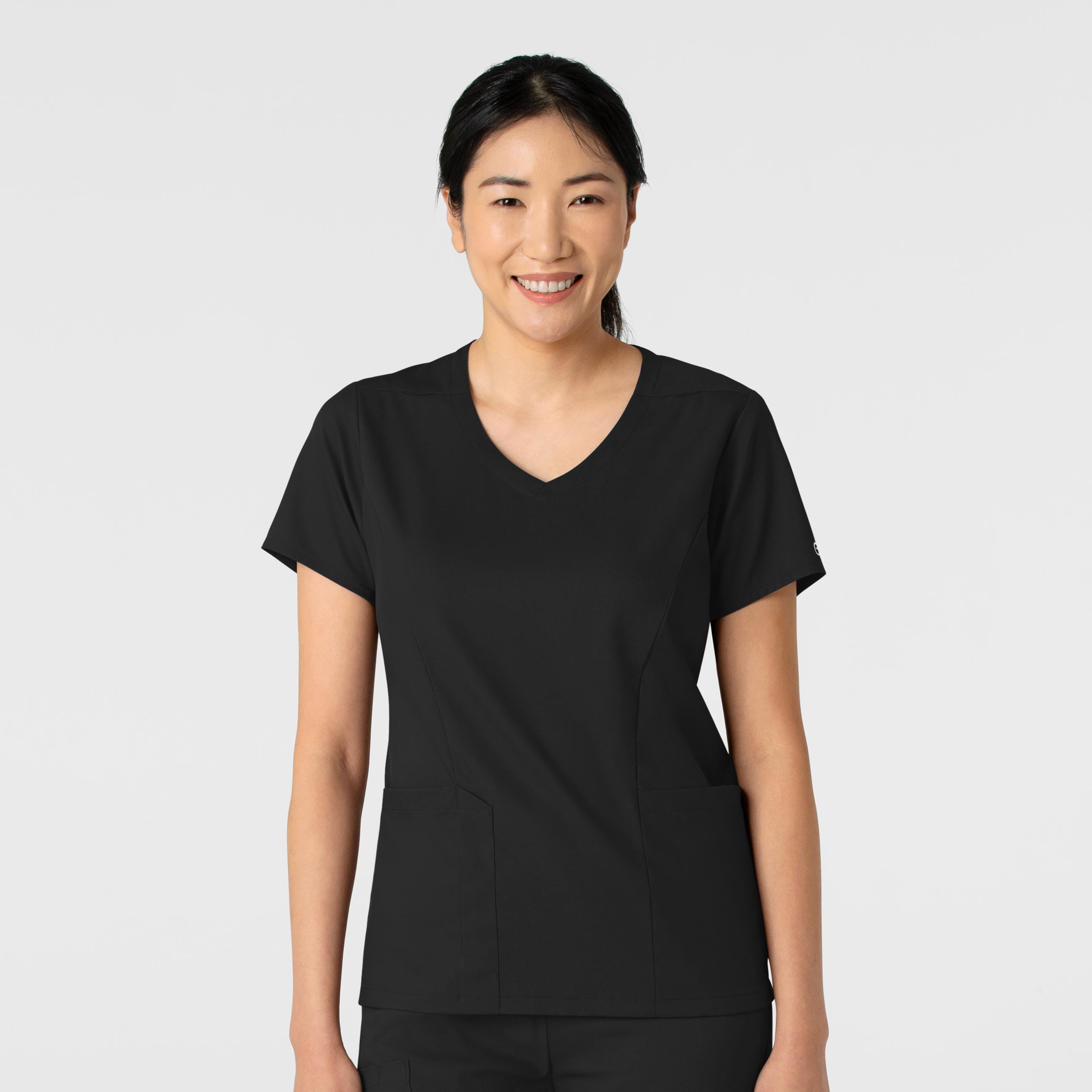 Black WonderWink 6251 Top worn by a person on a white background